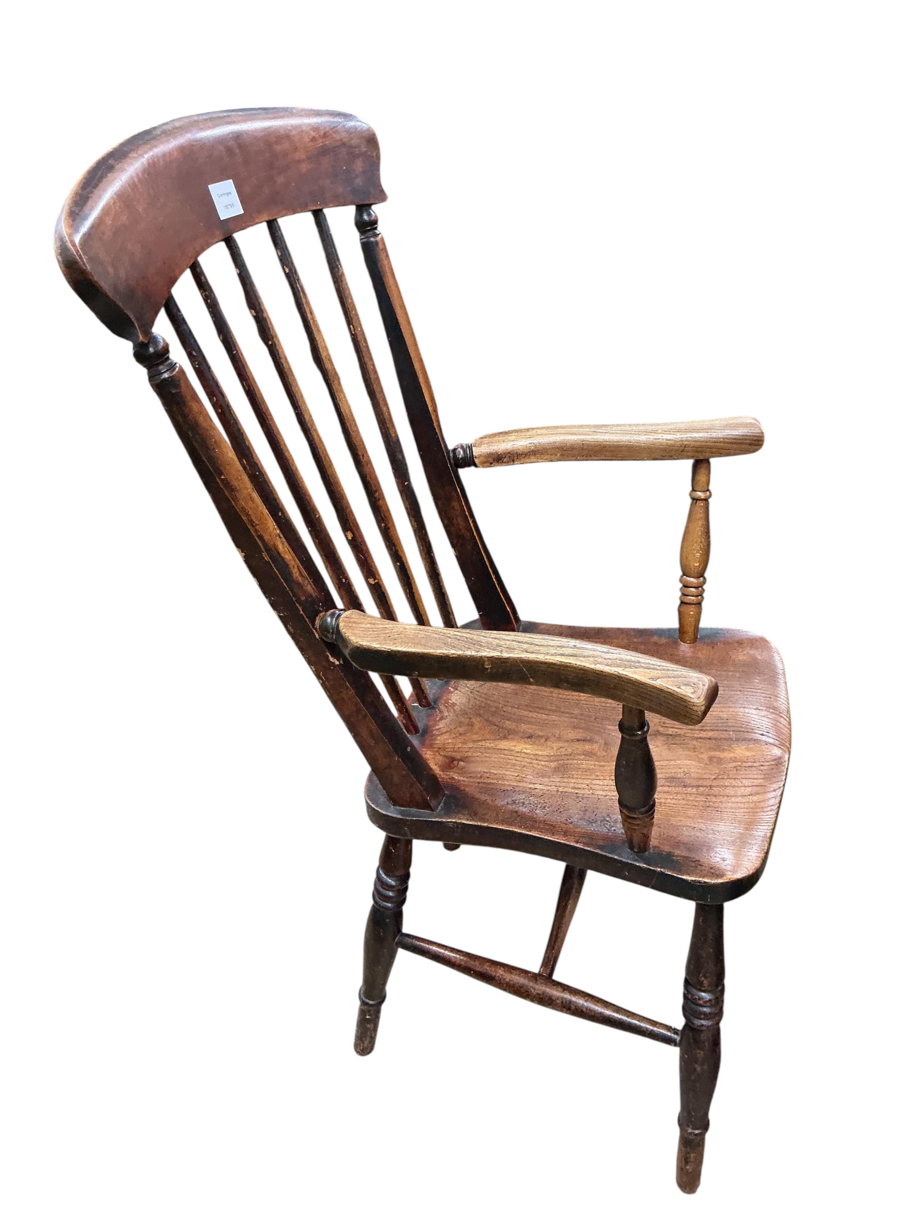A Victorian elm, ash and beech comb back armchair, width 56cm, depth 45cm, height 107cm